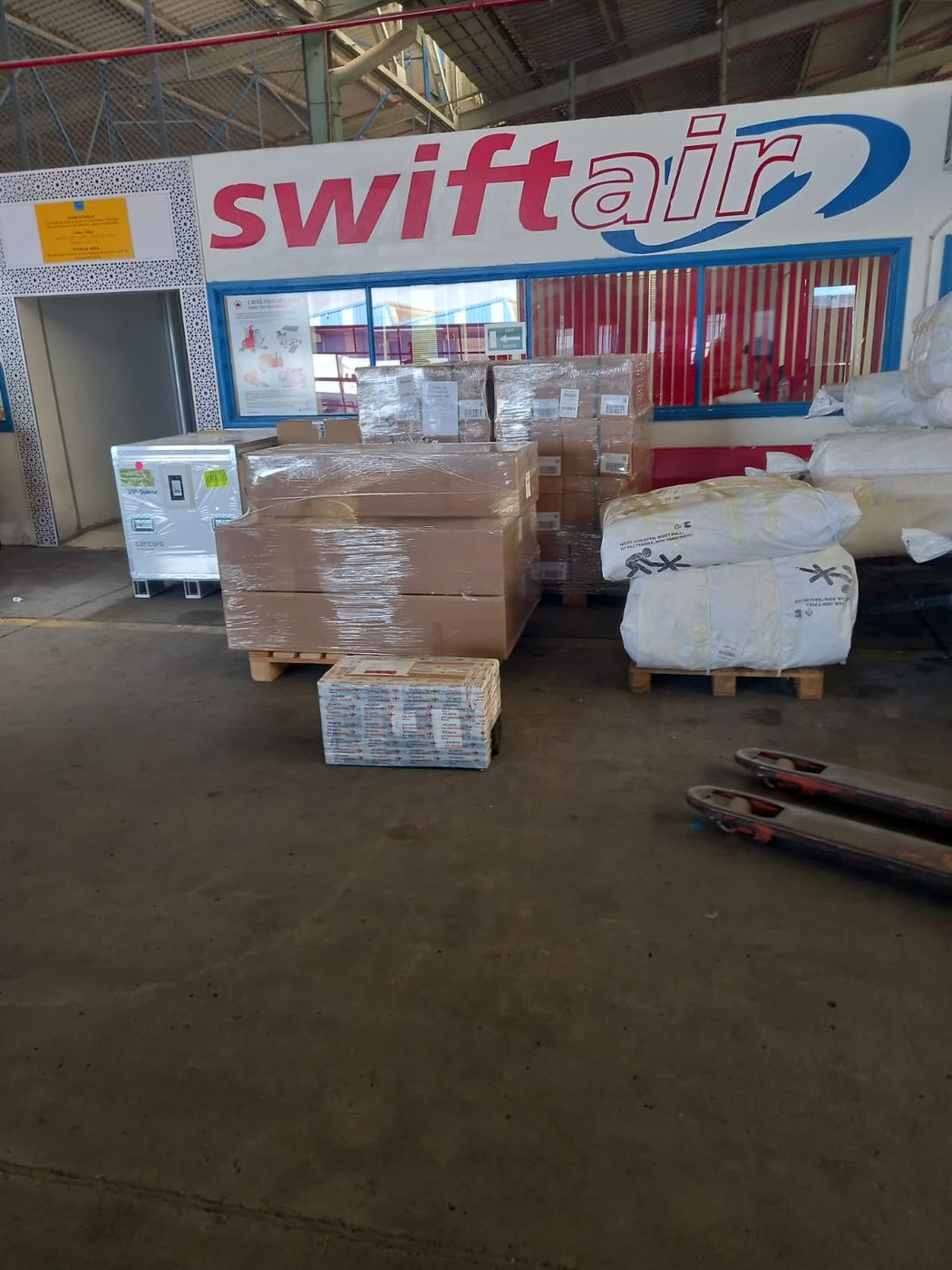Freight staged on a pallet at a freight terminal.